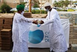 Mamadou Dia, World Water Council Governor, hands over soap bars to Soham El Wardini, Mayor of Dakar, Dakar, Senegal, 10 April 2020